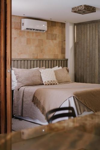 Ein Bett oder Betten in einem Zimmer der Unterkunft Passárgada Pousada