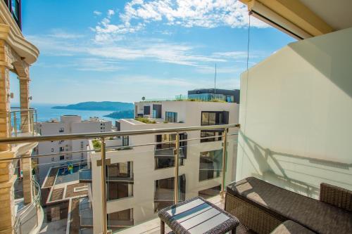 a balcony with a view of a building at The Dream Getaway & Spa by DeVasco in Becici