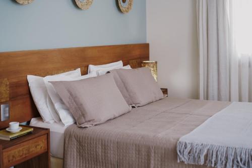 Ein Bett oder Betten in einem Zimmer der Unterkunft Passárgada Pousada