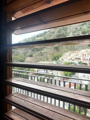 a window with a view of a balcony at Sillemi in Letojanni