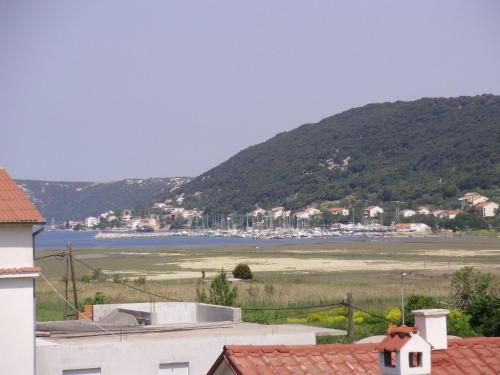 a view of a harbor with boats in the water at Apartment Ani in Supetarska Draga