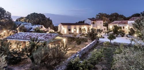 an aerial view of a villa at night at Gallicantu Stazzo Retreat in Luogosanto