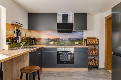 a kitchen with a sink and a stove at Seeperle Lochau - Der See ruft! in Lochau