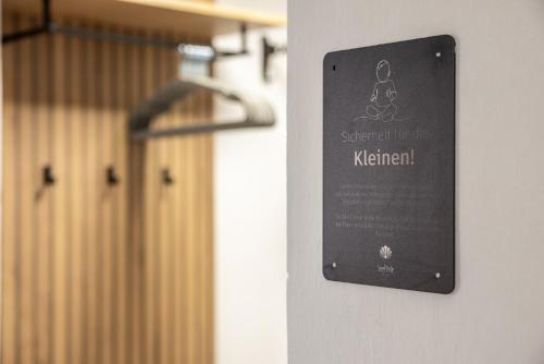 a sign on the wall of a gym at Seeperle Lochau - Der See ruft! in Lochau