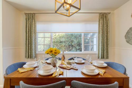 a dining room with a table and chairs and a window at Goleta Getaway by AvantStay Private Backyard 1.5mi to the Beach in Santa Barbara