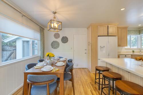 a kitchen and dining room with a table and chairs at Goleta Getaway by AvantStay Private Backyard 1.5mi to the Beach in Santa Barbara