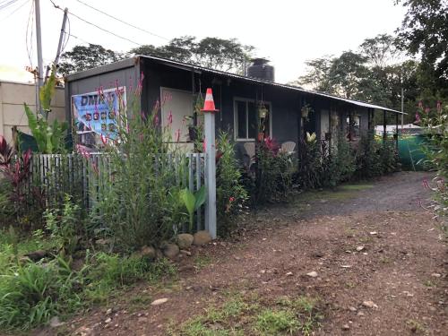 a house with a red cone on the side of it at Apartamentos Equipados DMR #3 in Uvita