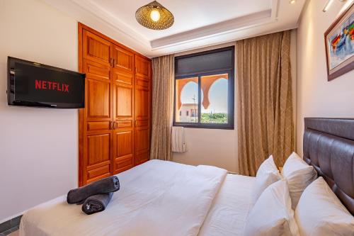 Cama o camas de una habitación en Villa Riad Targa 10 min de GUELIZ Piscine privee