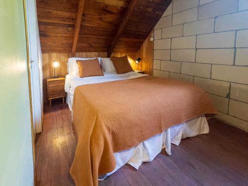 Ένα ή περισσότερα κρεβάτια σε δωμάτιο στο Wesley House Hosteria Boutique