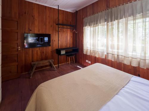 Postel nebo postele na pokoji v ubytování Wesley House Hosteria Boutique