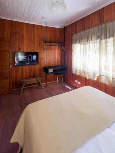 Ένα ή περισσότερα κρεβάτια σε δωμάτιο στο Wesley House Hosteria Boutique