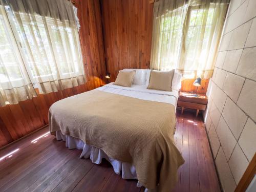 Ένα ή περισσότερα κρεβάτια σε δωμάτιο στο Wesley House Hosteria Boutique
