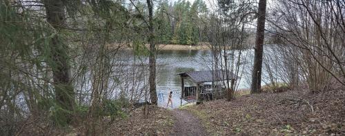 a small house in the middle of a lake at Käbi Holiday Homes in Ainja