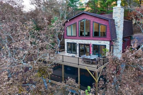 an aerial view of a house with a deck at The Swirling Bird in Basye