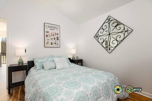 a bedroom with a bed and two night stands at The Swirling Bird in Basye