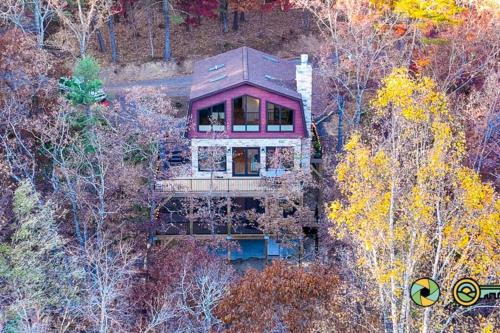 an aerial view of a house in the woods at The Swirling Bird in Basye