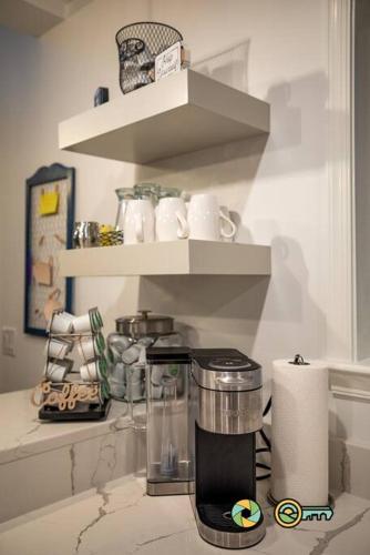 a kitchen with a coffee maker on a counter at The Swirling Bird in Basye