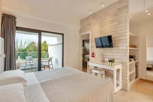 Postel nebo postele na pokoji v ubytování VOI Alimini Resort