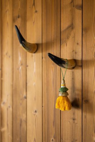 a wall with a bird decoration on it at The Pines Bucegi Lodge in Bran