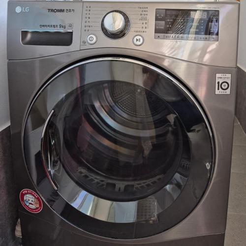 a washing machine with its door open in a room at Gyeongju Florian Stay Stay Close Explore More in Gyeongju