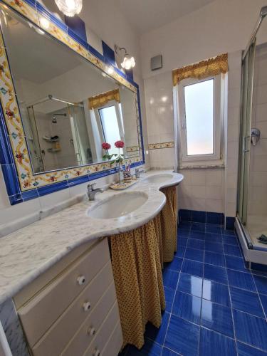 a bathroom with a sink and a mirror at Country House with Pool in Nerola in Nerola