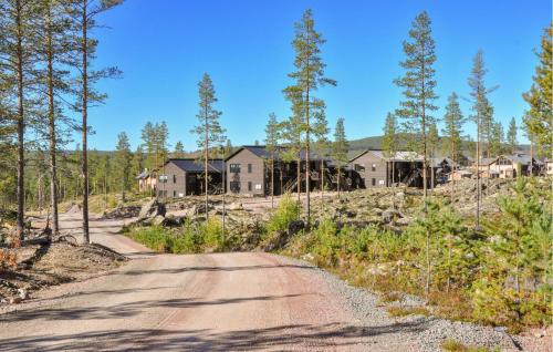 a dirt road in front of a house at Gorgeous Home In Idre With Sauna in Idre