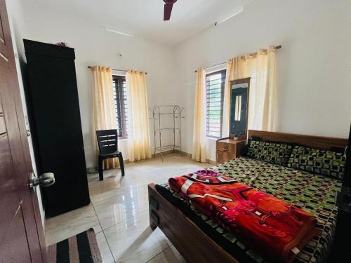 Postel nebo postele na pokoji v ubytování Nilaavu Homes - The Staycation at Wayanad