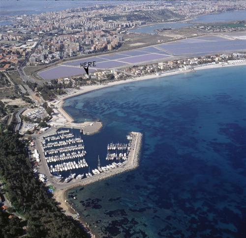 a large body of water with a city skyline at Villabeachcity Guesthouse in Cagliari