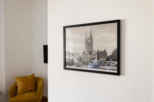 a picture of a church hanging on a wall at Gästehaus am Winckel in Stendal