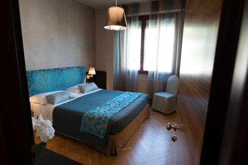Ένα ή περισσότερα κρεβάτια σε δωμάτιο στο Park Hotel Meublé