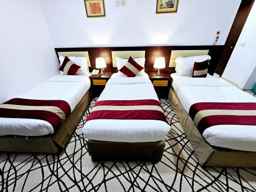 Postel nebo postele na pokoji v ubytování Ajyal Al Madina Hotel 3