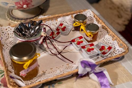 a tray with three jars of honey on a table at Villa Norma in Órma