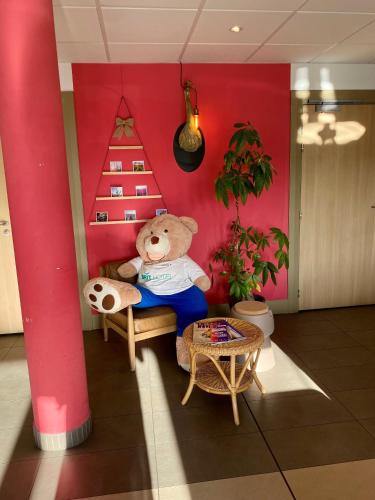 Гостиная зона в Brit Hotel Reims Croix Blandin