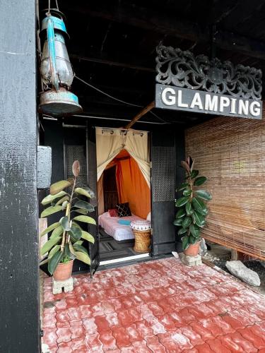a room with a tent with a bed in it at Kejora Homestay in Kangar