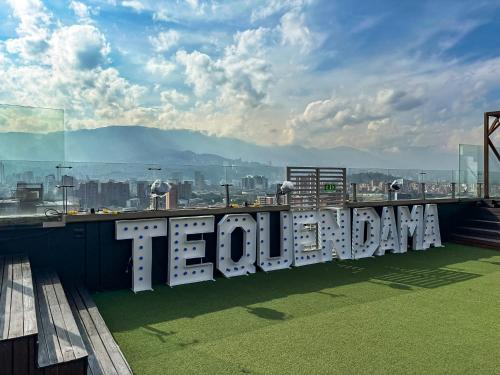 a sign on the top of a building that says tomorrow at Tequendama Hotel Medellín - Estadio in Medellín