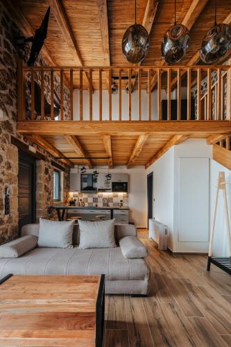 a living room with a couch and a table at Πηγή Τραγανιστή in Kato Trikala Korinthias