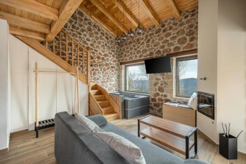 a living room with a couch and a table at Πηγή Τραγανιστή in Kato Trikala Korinthias