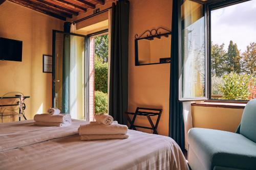 A bed or beds in a room at Agriturismo San Sano