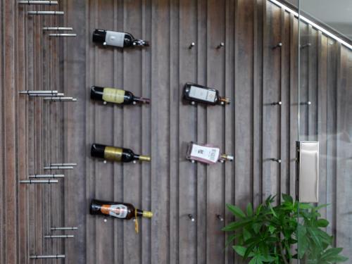 four bottles of wine on a wooden wall at The Views at 492 Euphoria Golf Estate in Naboomspruit