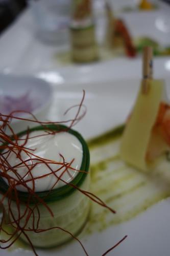 a bowl of whipped cream and spices on a cutting board at Villa Bucher - Metnitztalerhof in Friesach