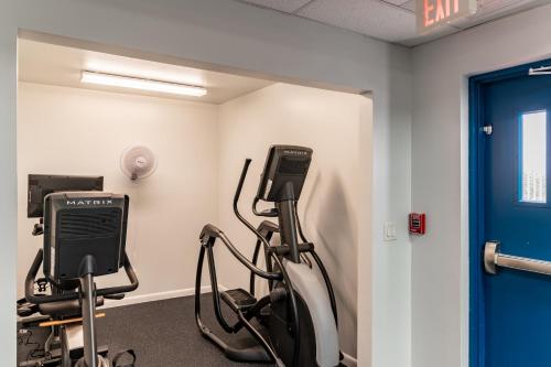 a gym with a treadmill and a exercise bike at Recently Renovated Beachfront Gem in Paradise! in Marco Island