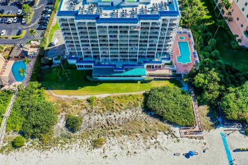 an aerial view of a large building on the beach at Recently Renovated Beachfront Gem in Paradise! in Marco Island
