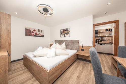 Postel nebo postele na pokoji v ubytování Haus Kofler