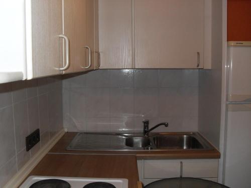 a small kitchen with a sink and a stove at Belle Vue in Fürth