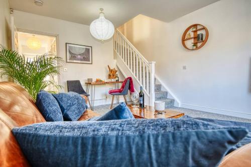 a living room with a couch and a staircase at Gornal Dudley-2bed-Contractor &Long stay -Parking in Gornalwood