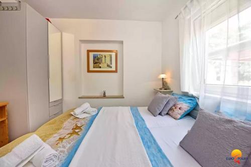 Ένα ή περισσότερα κρεβάτια σε δωμάτιο στο Villa Kjara