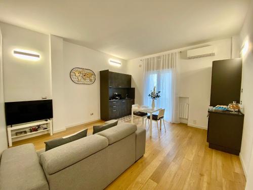 a living room with a couch and a table at A&A B&B Piccinni in Bari