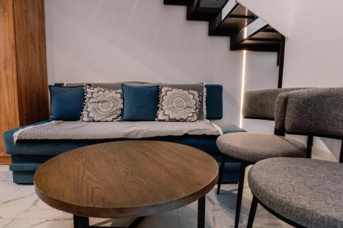 a living room with a couch and a table at Endless View loft in Mesimvría