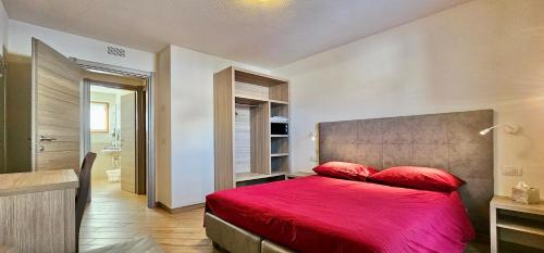 Ένα ή περισσότερα κρεβάτια σε δωμάτιο στο Casa Fiocco Di Neve