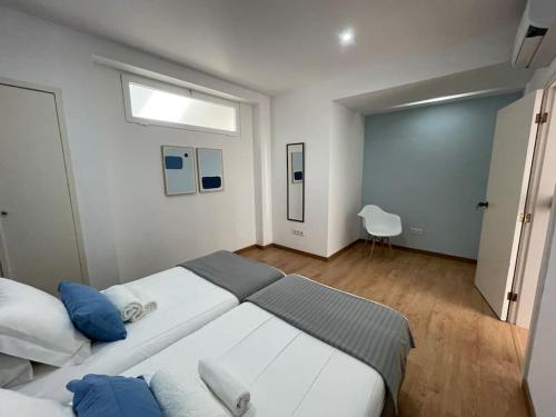 Ένα ή περισσότερα κρεβάτια σε δωμάτιο στο OCEAN Apartamentos Vista do Atlântico